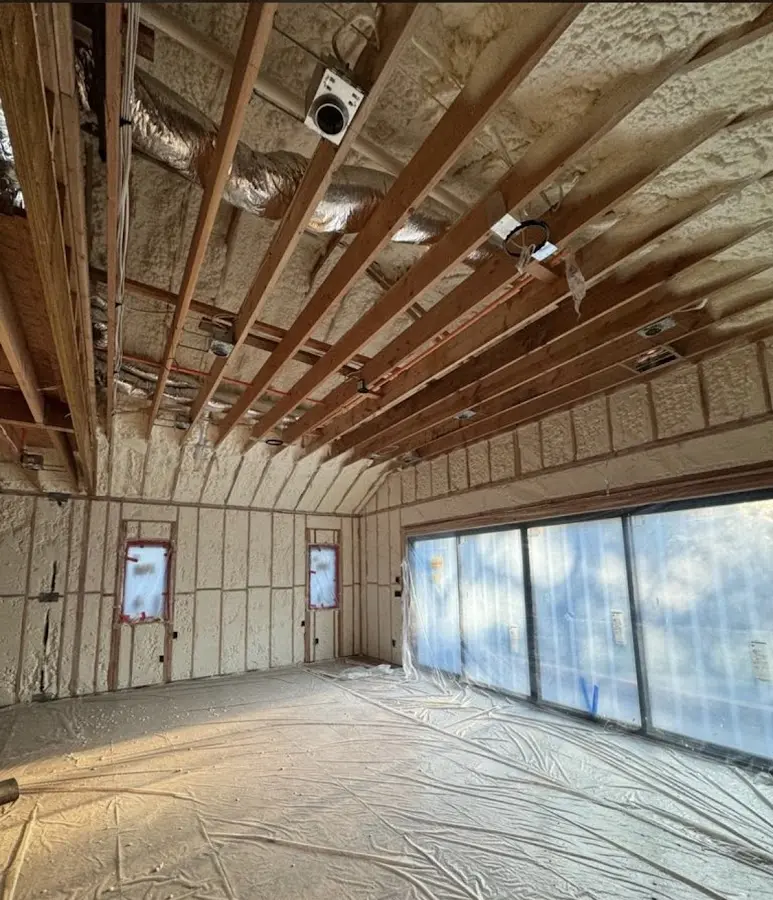 Interior walls and ceiling insulated with spray foam during new construction in Prospect Park